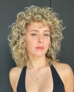13 alt Soft Collarbone Butter Blonde Shag for Curly Hair name naiaroberts hair